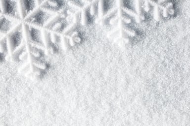 Big snowflakes on a snow field.
