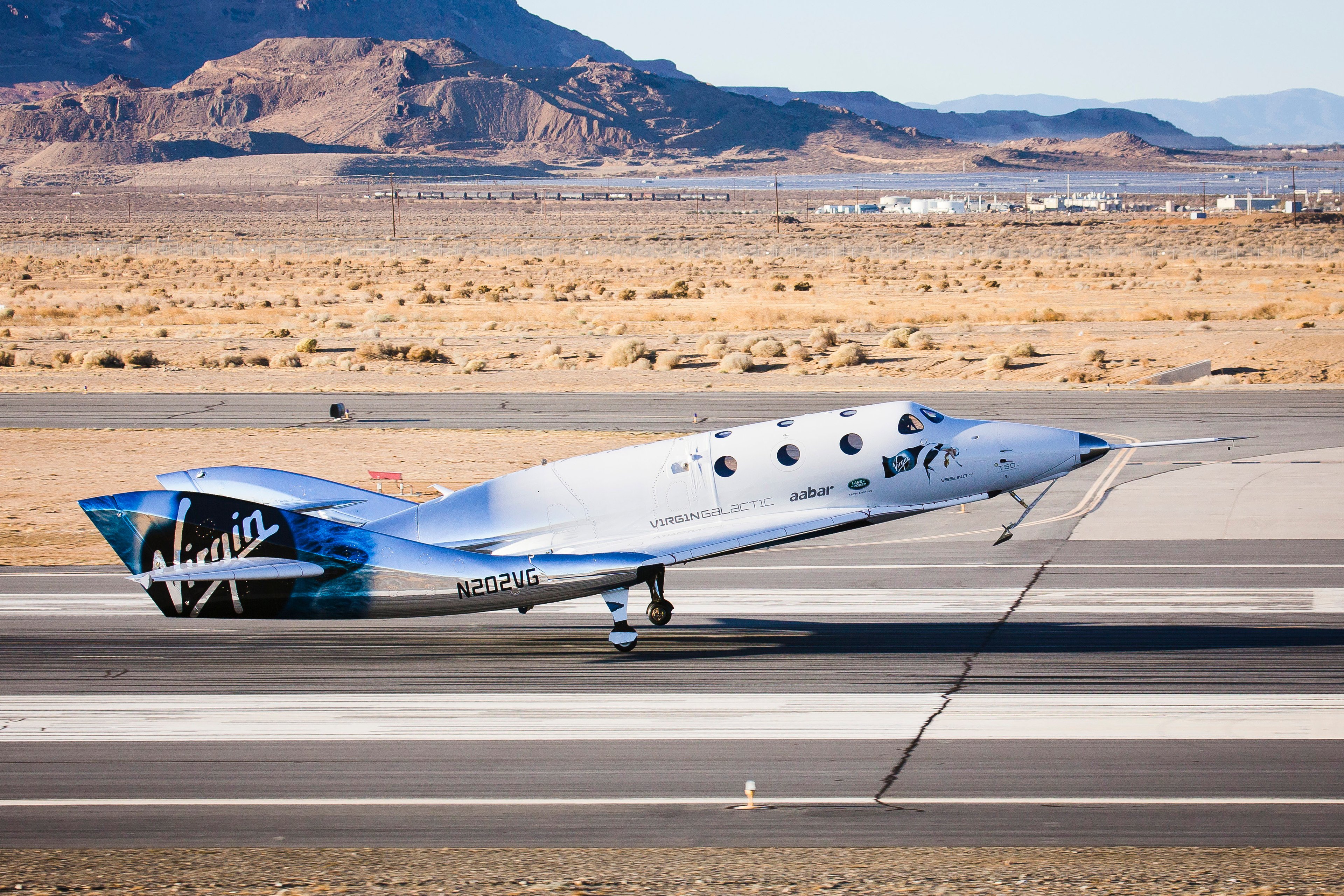 Virgin Galactic spacecraft touching down on runway. 