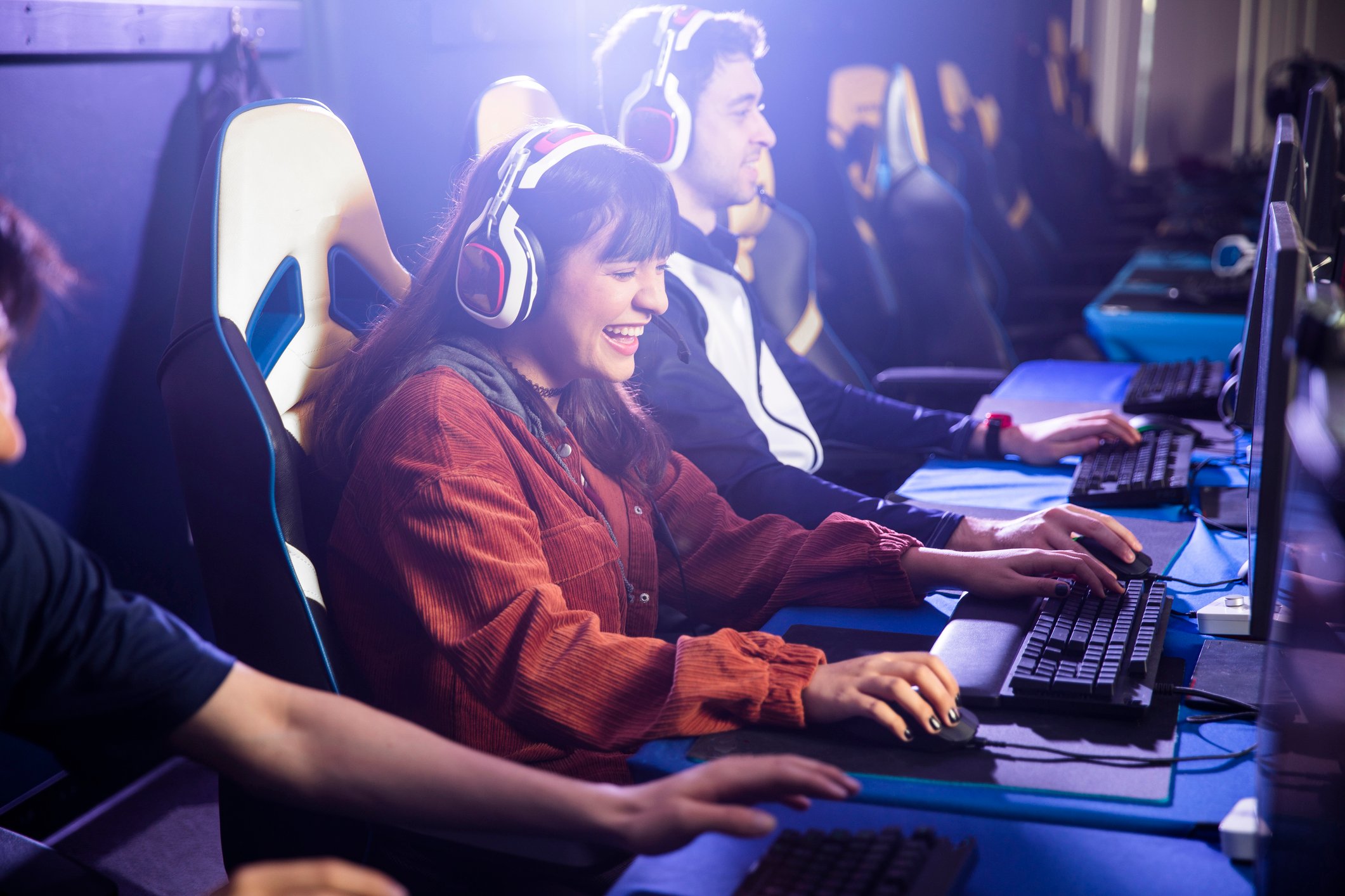 People playing games on computers. 