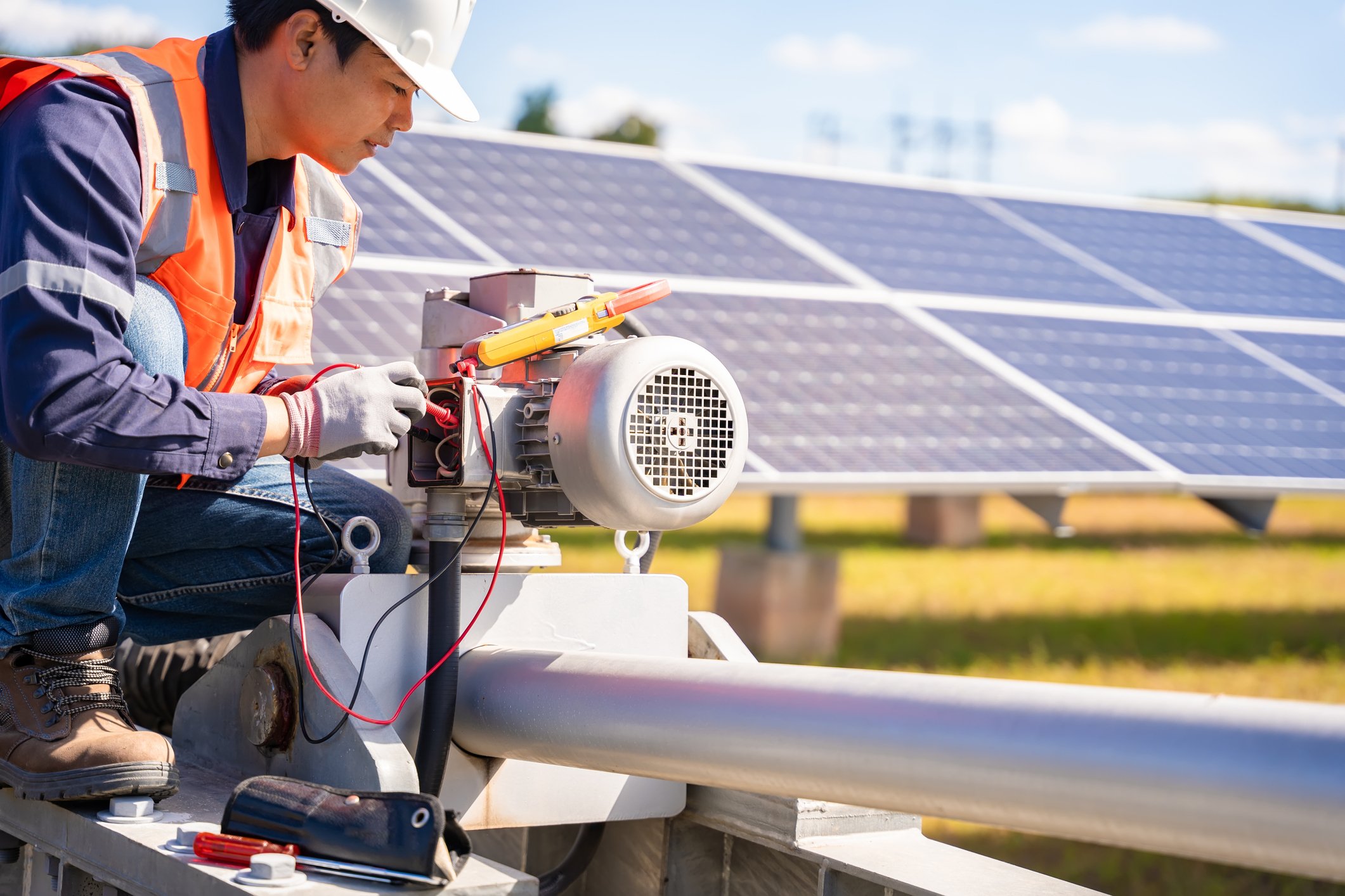 A technician works on solar power plant equipment.