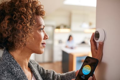 woman using a smart home device