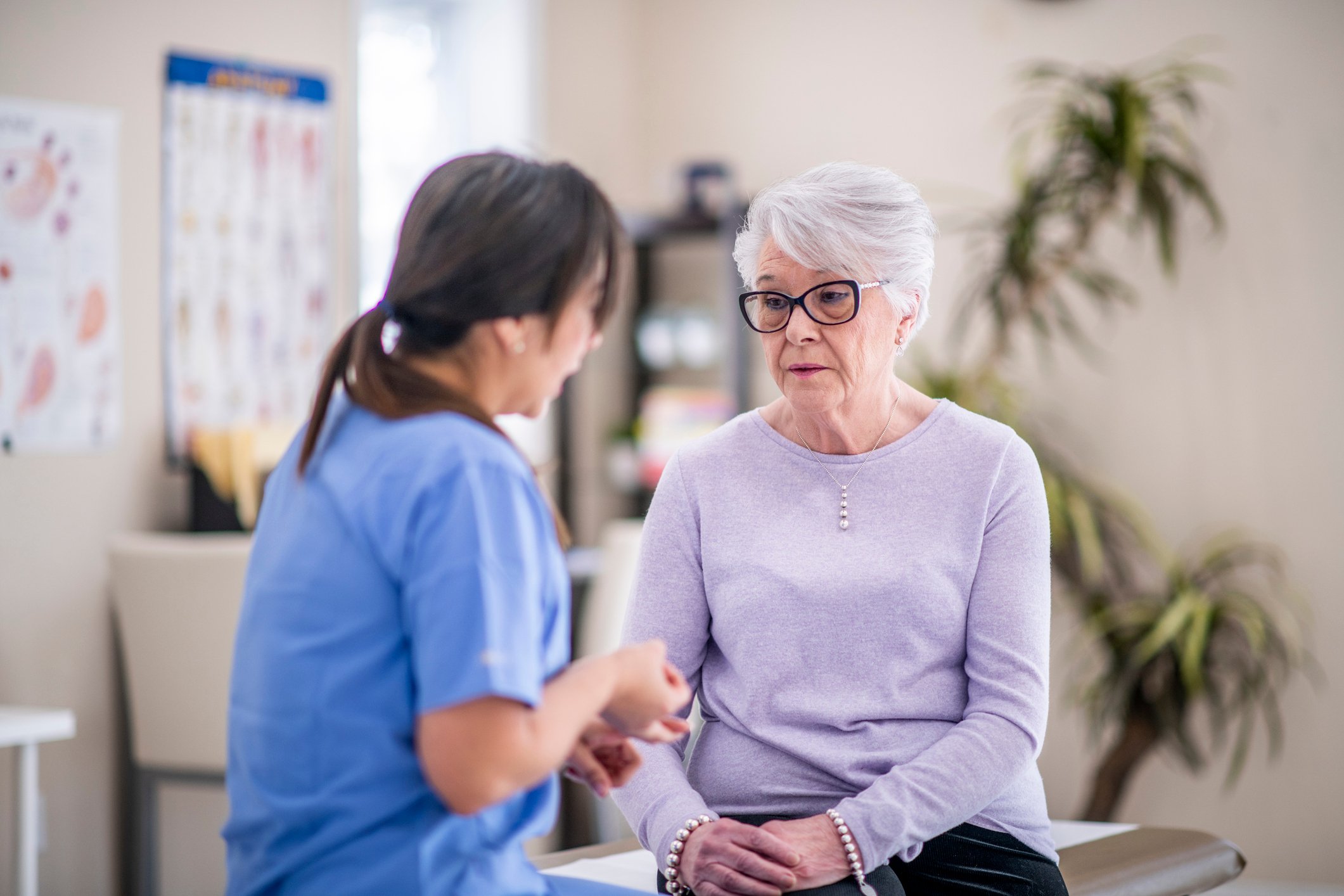 Medical professional talking to patient. 