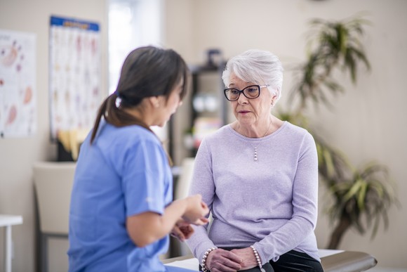 Medical professional talking to patient. 