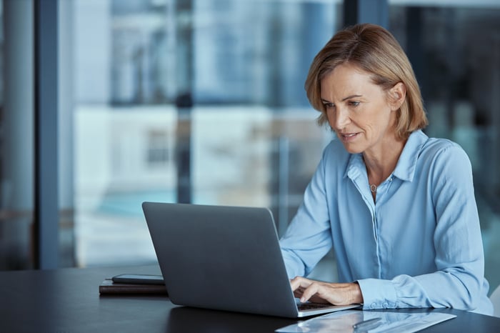 A person at a laptop.