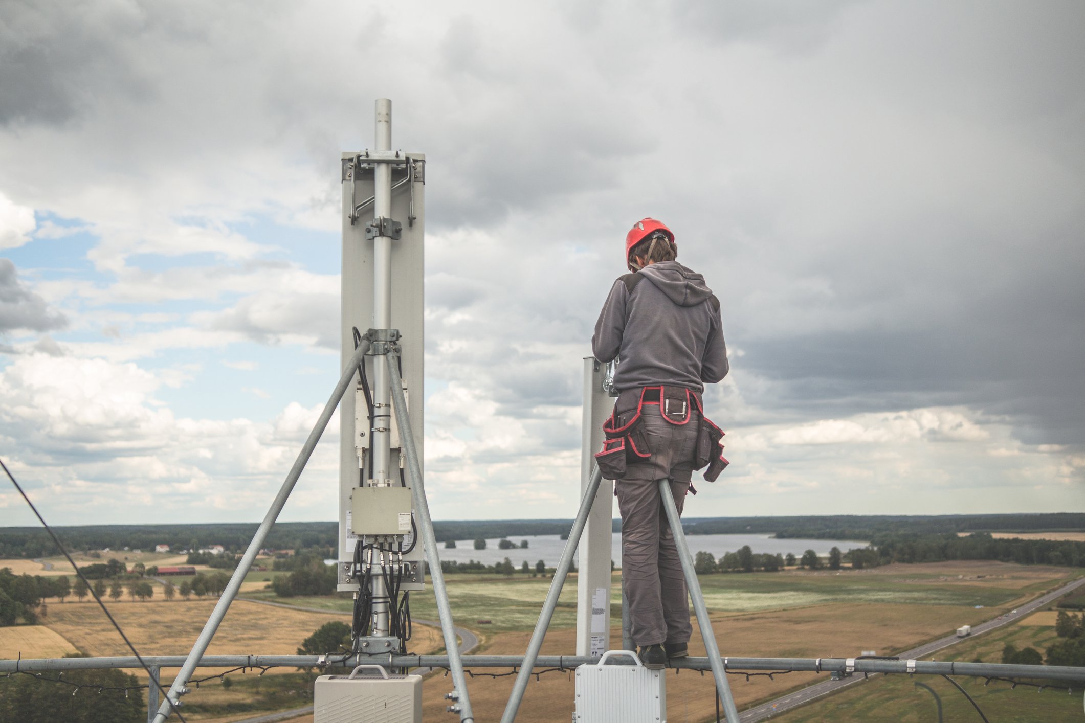 Worker at the top of a cell tower.