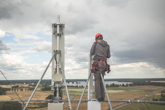 Worker at the top of a cell tower.