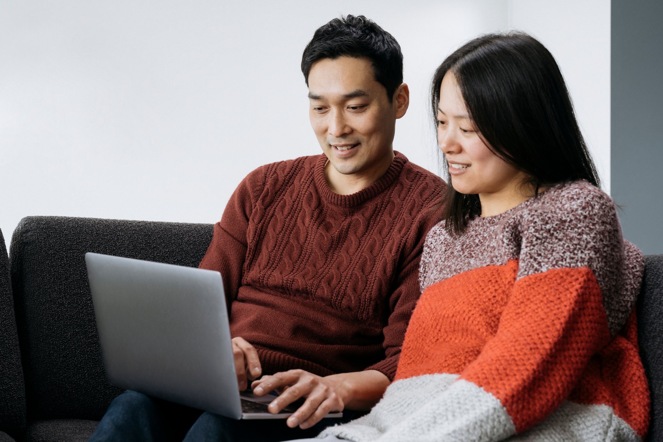 Asian couple, laptop