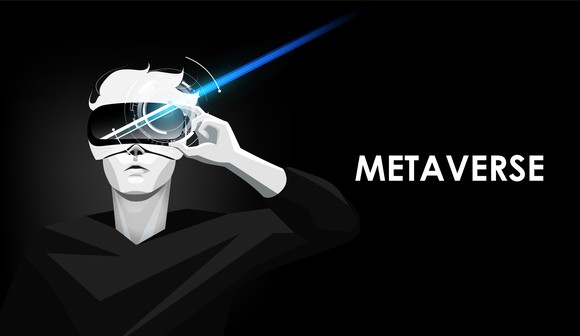 Cartoon person wearing VR goggles with the word "metaverse" on the screen.