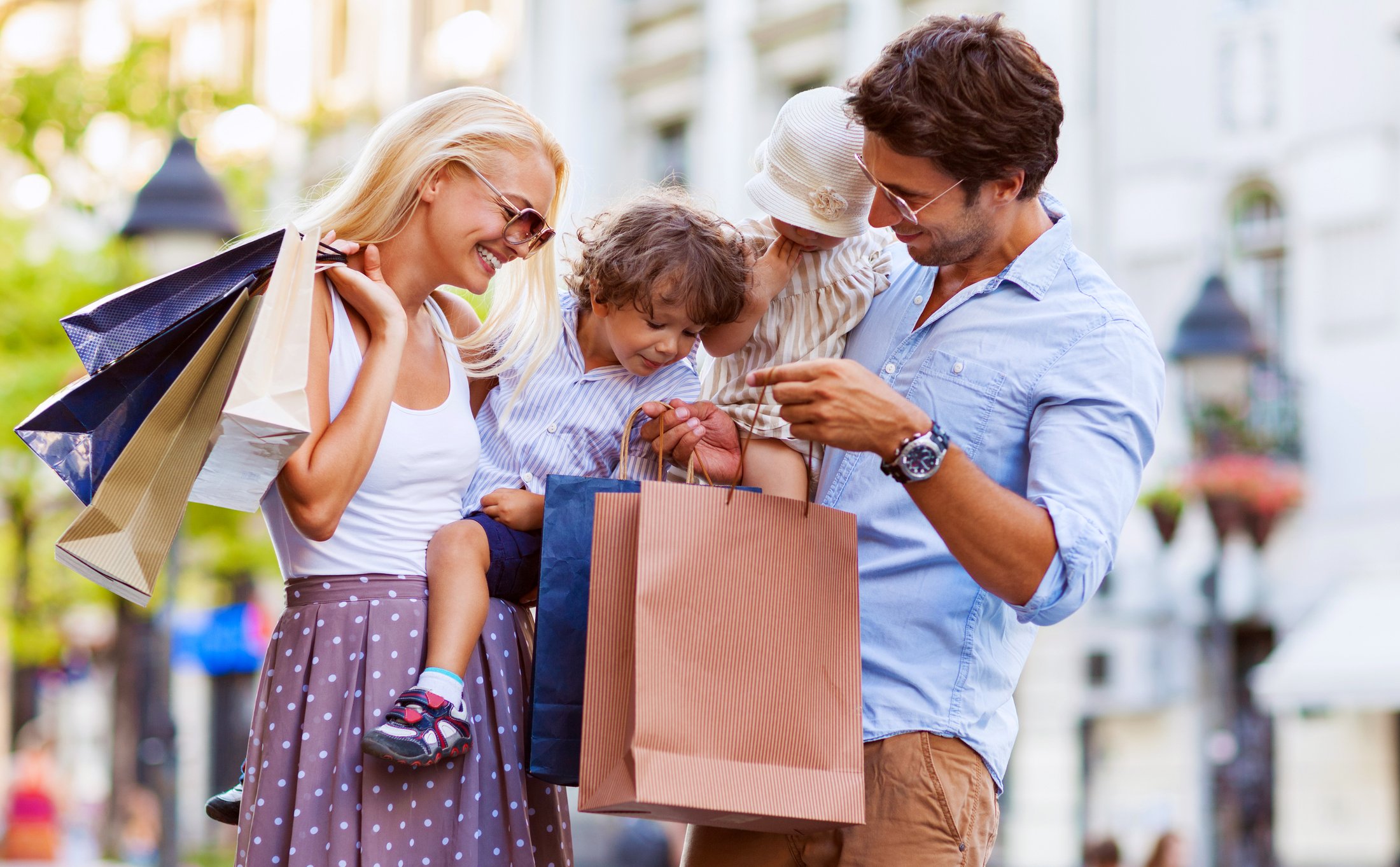 Family enjoying an open-air shopping center.