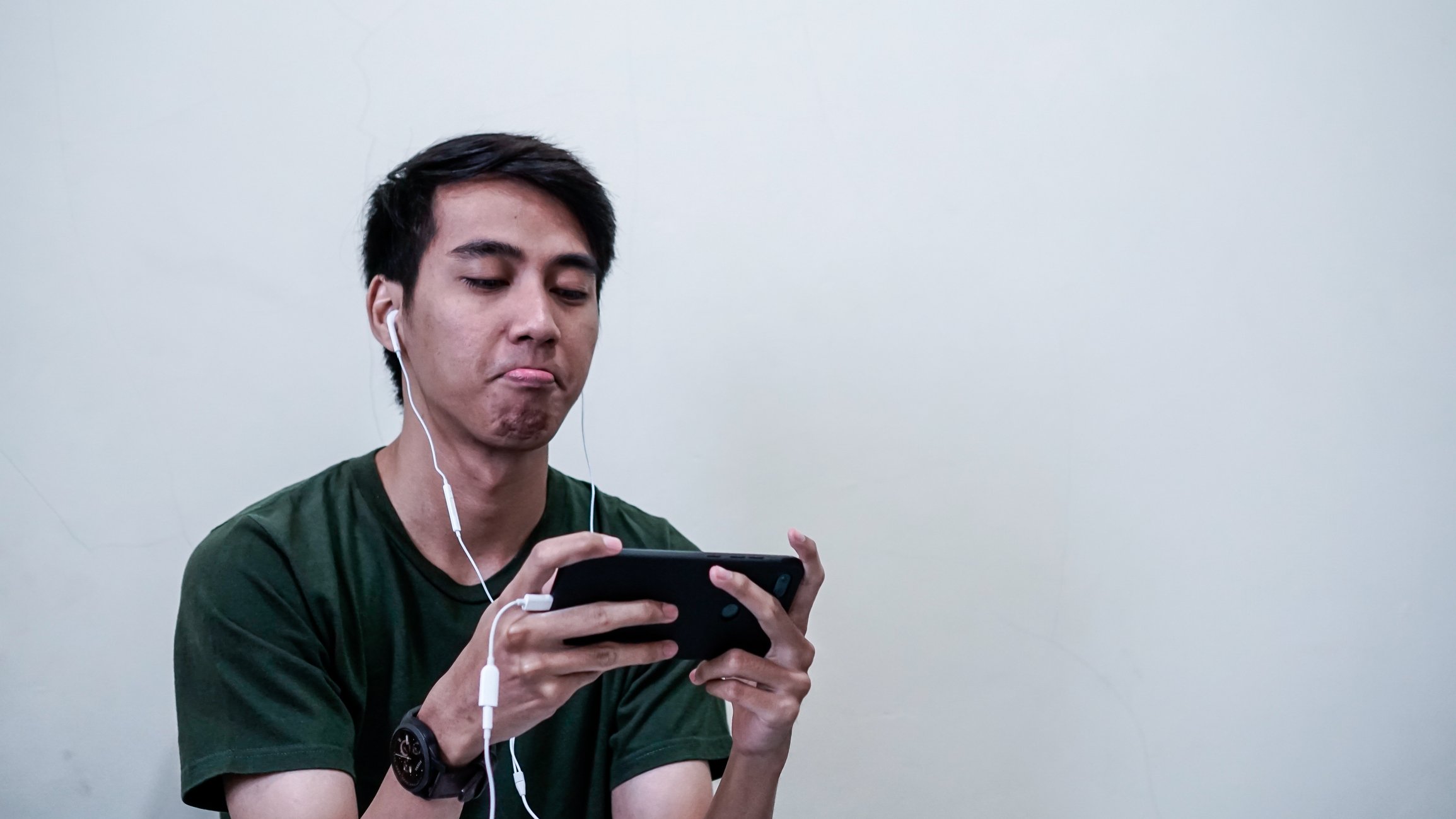 Mobile gamer upset after playing a game.