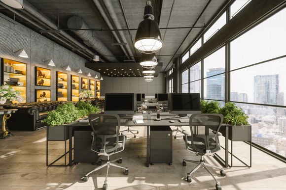 Empty modern office space overlooking big city.