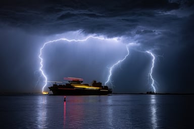 3 lightning strikes around a cruise ship.