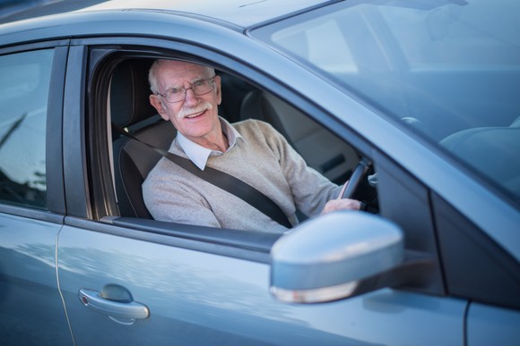 Person sitting in a rental car.