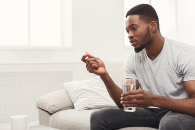 Pill, man, glass of water