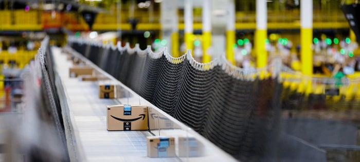 Packages moving through an Amazon warehouse.