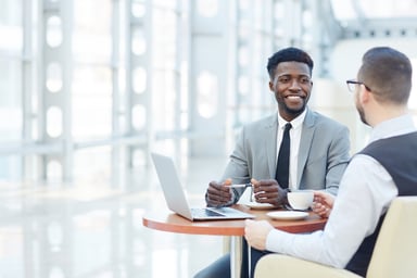 Business people sitting at a table.