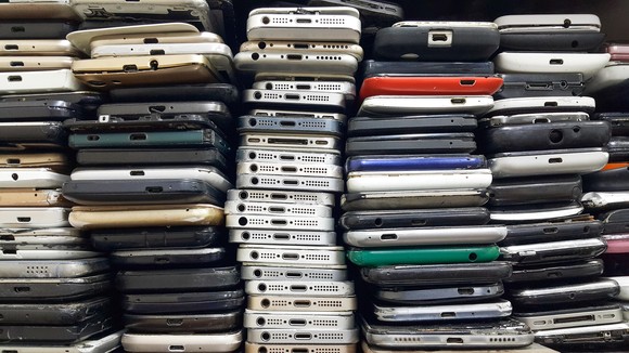 Piles of used smartphones.
