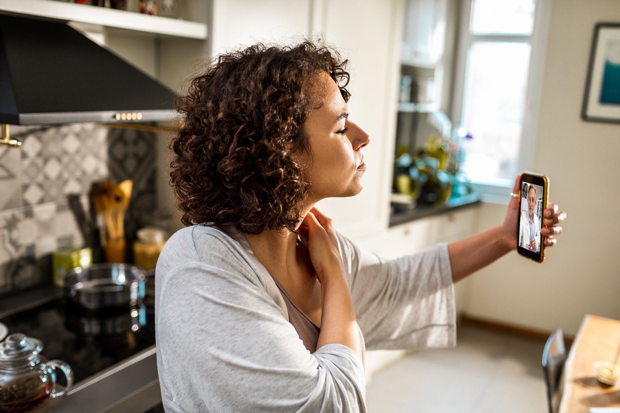 Patient consulting with a doctor over the phone.