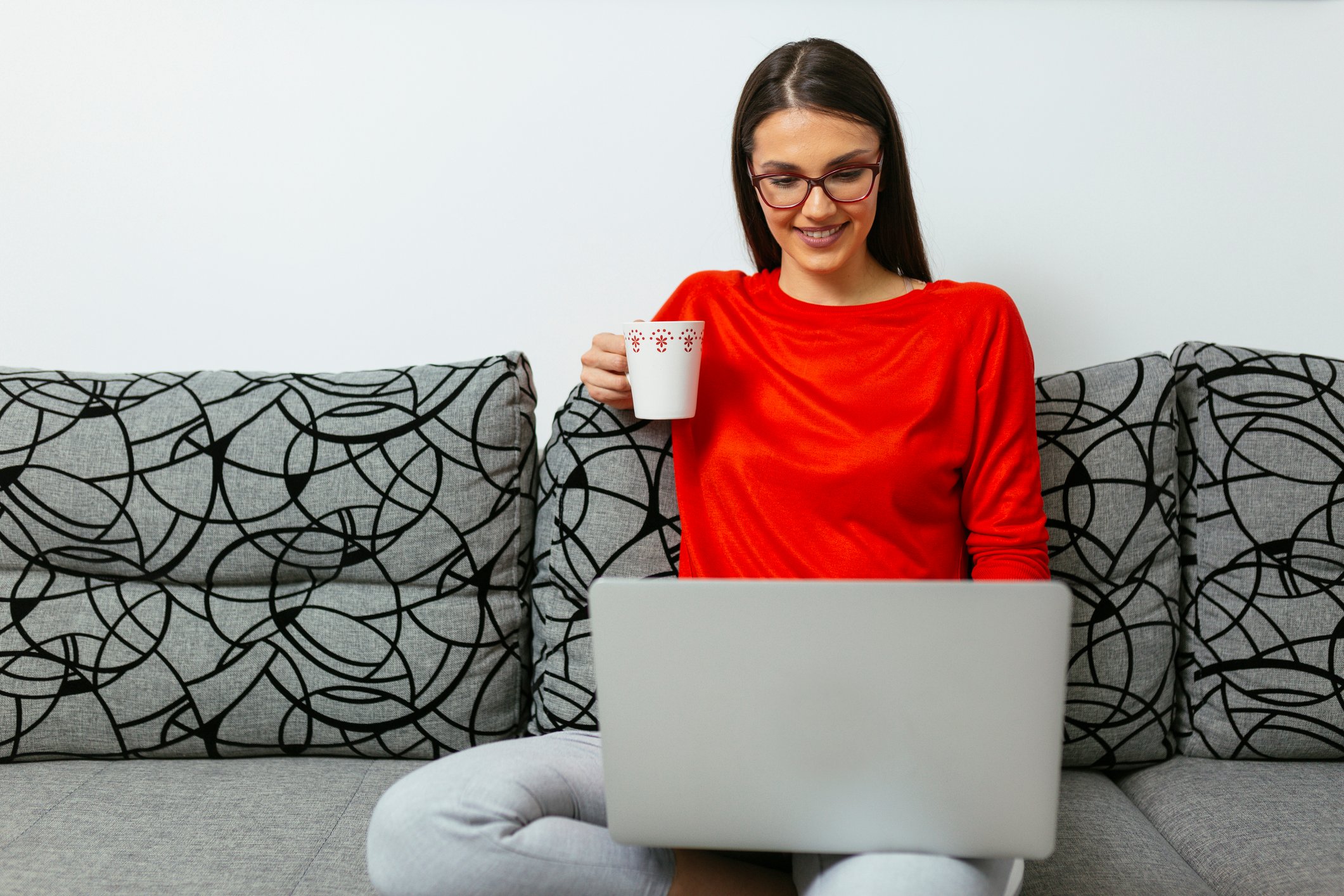 Young woman smiling, laptop