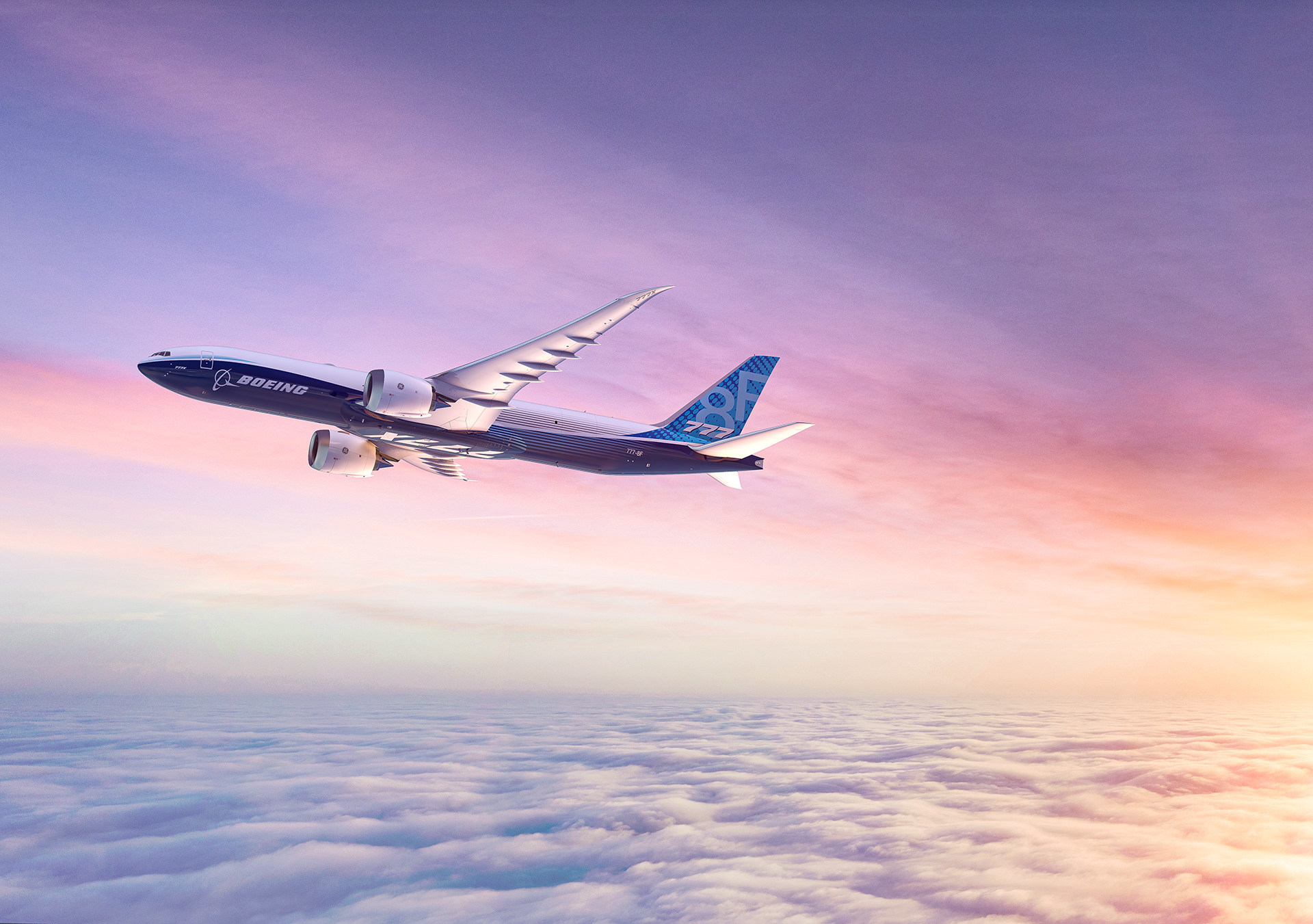 A rendering of a Boeing 777-8 freighter flying over clouds.