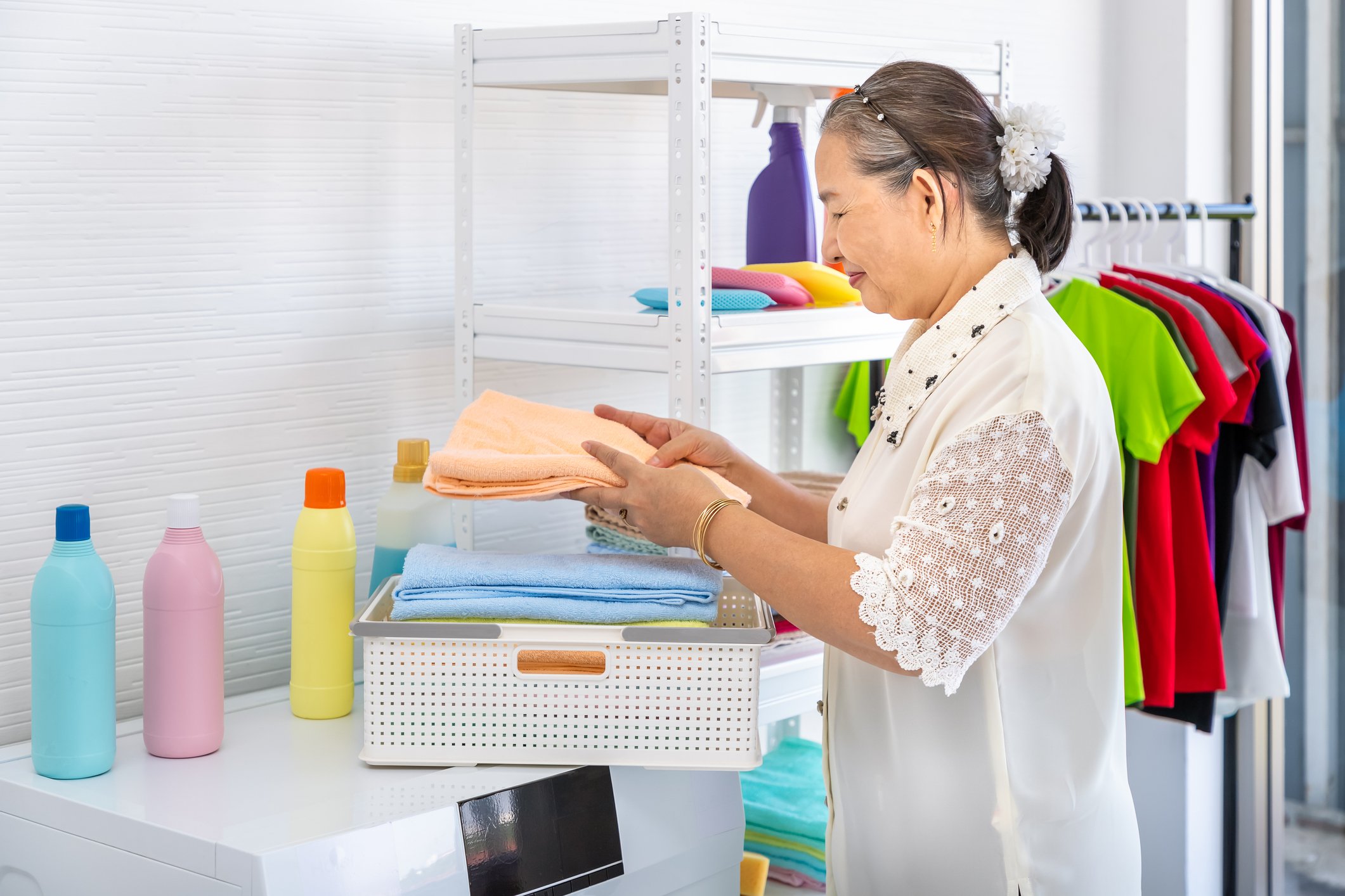 A woman folding laundry.