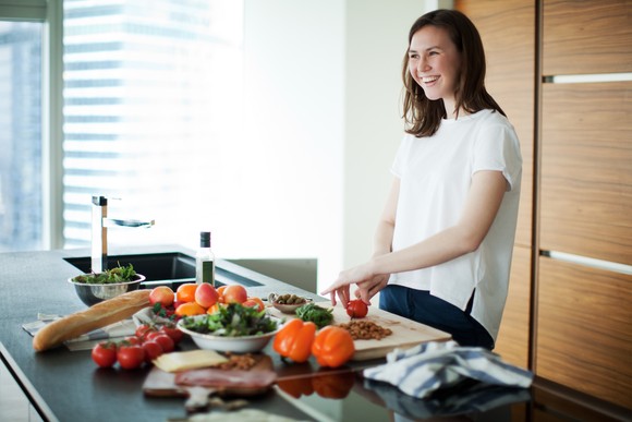 Person preparing food on the counter.