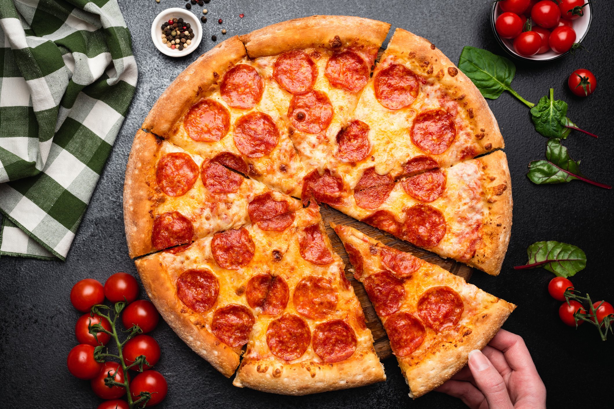 A pepperoni pizza cut into slices.