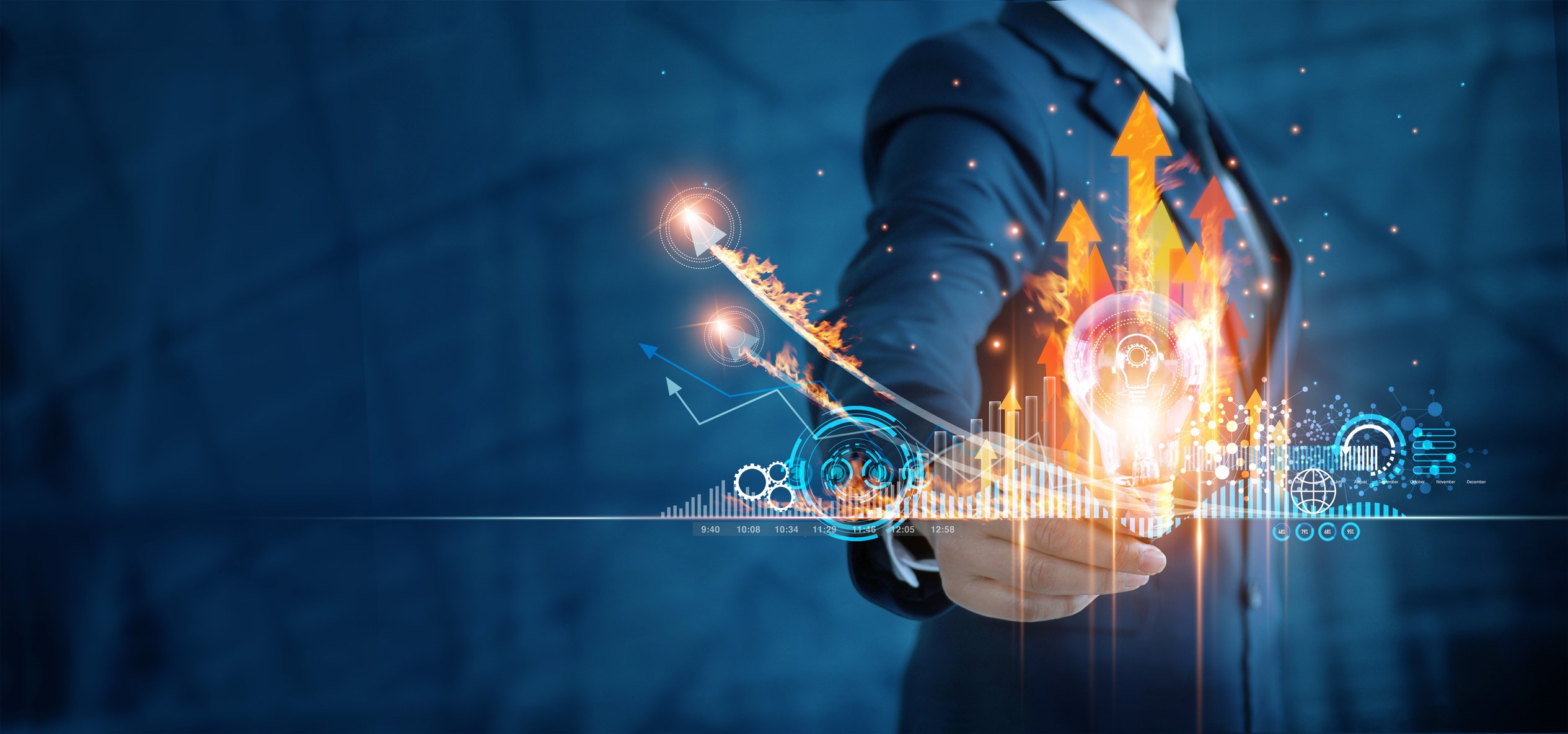 a man points to an illustration of a chart with flaming arrows pointing upward