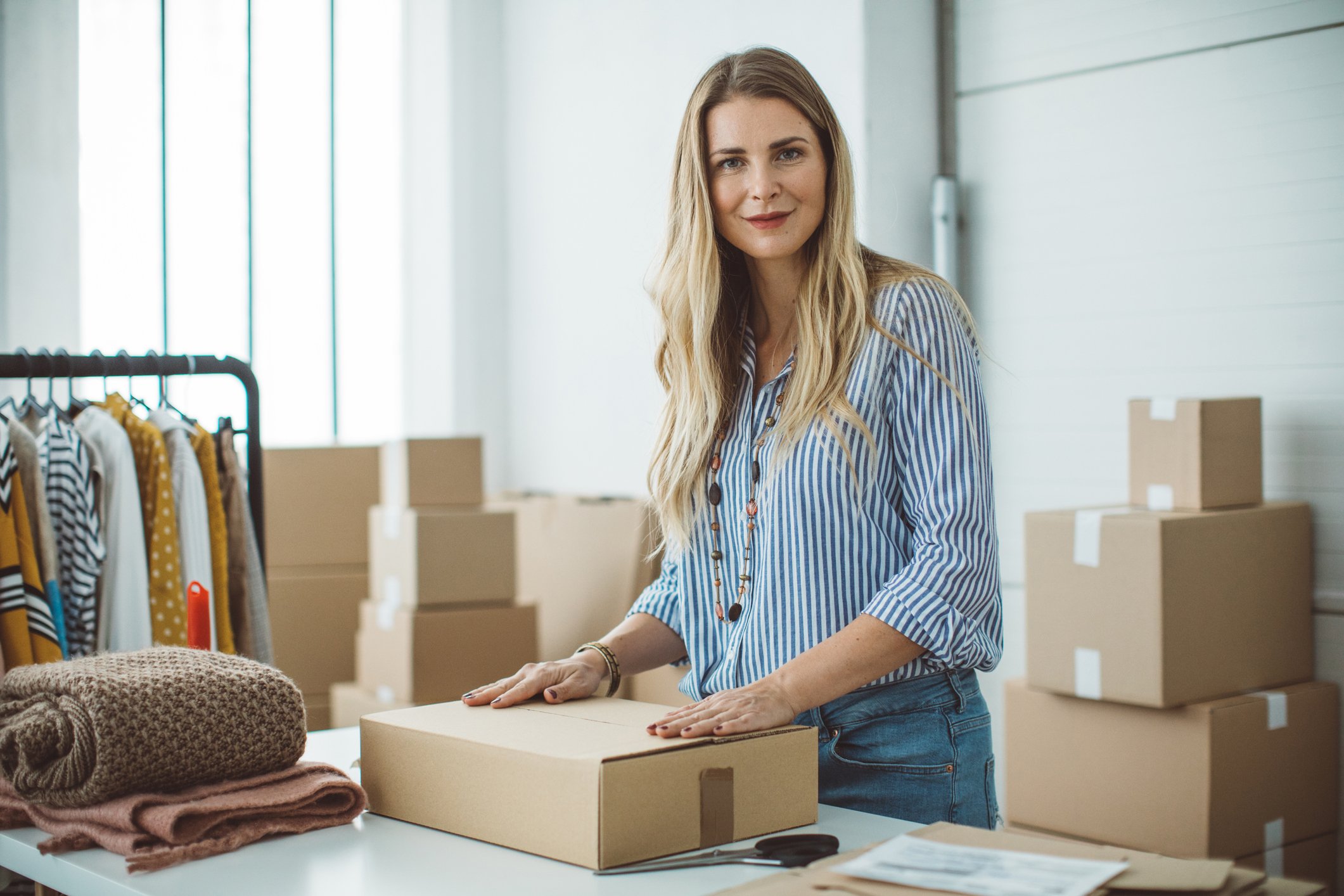 A person holding a box for delivery. 