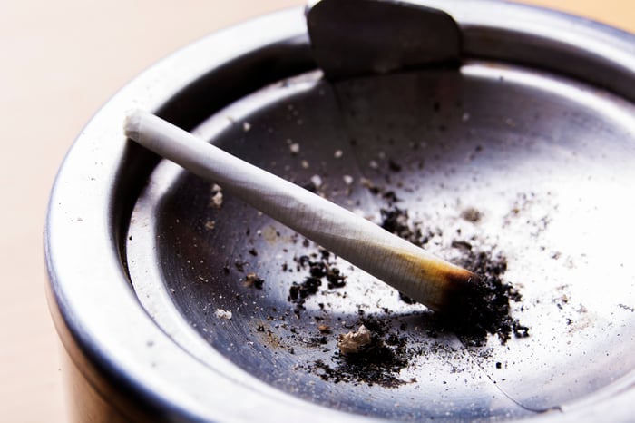 Marijuana joint stubbed out in a metal ashtray.