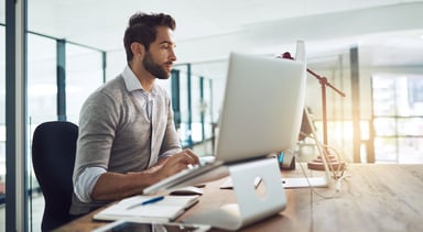man using computer at office