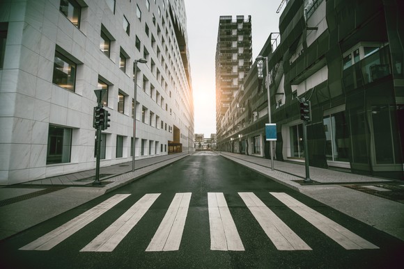 Empty city street, sidewalks, and crosswalk.