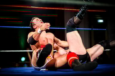 two pro wrestlers in wrestling ring