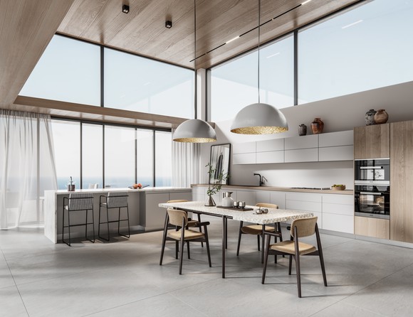 A modern open-concept kitchen on the top floor of a home with large windows.