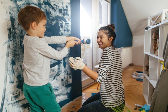 A family painting a room.