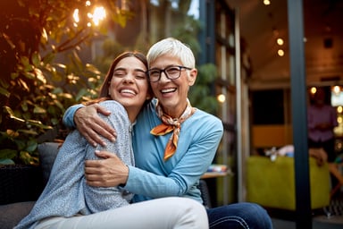Senior mother and adult daughter hugging