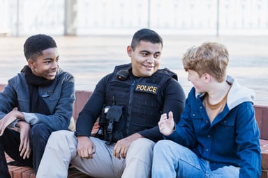 Officer Talking With Two Younger Kids
