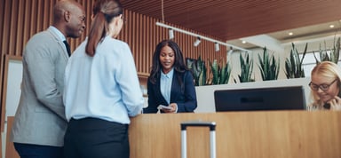 People Checking Into Hotel