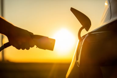 electric vehicle charger at sunset