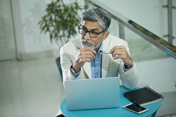 A person at a laptop.