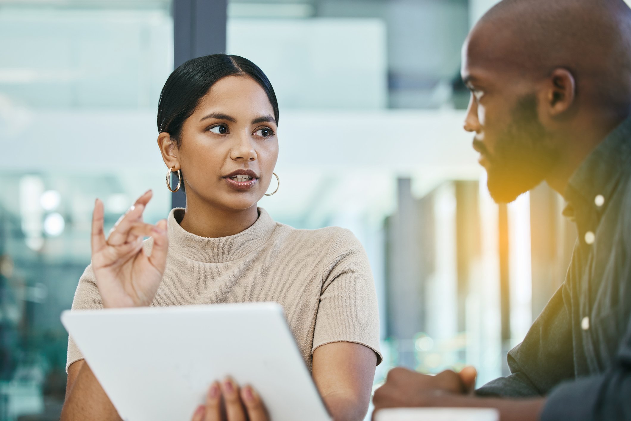 Two business people at a meeting.