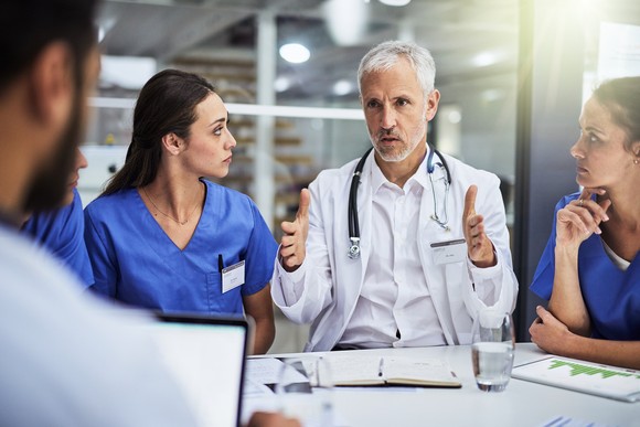 Doctor talking to colleagues.