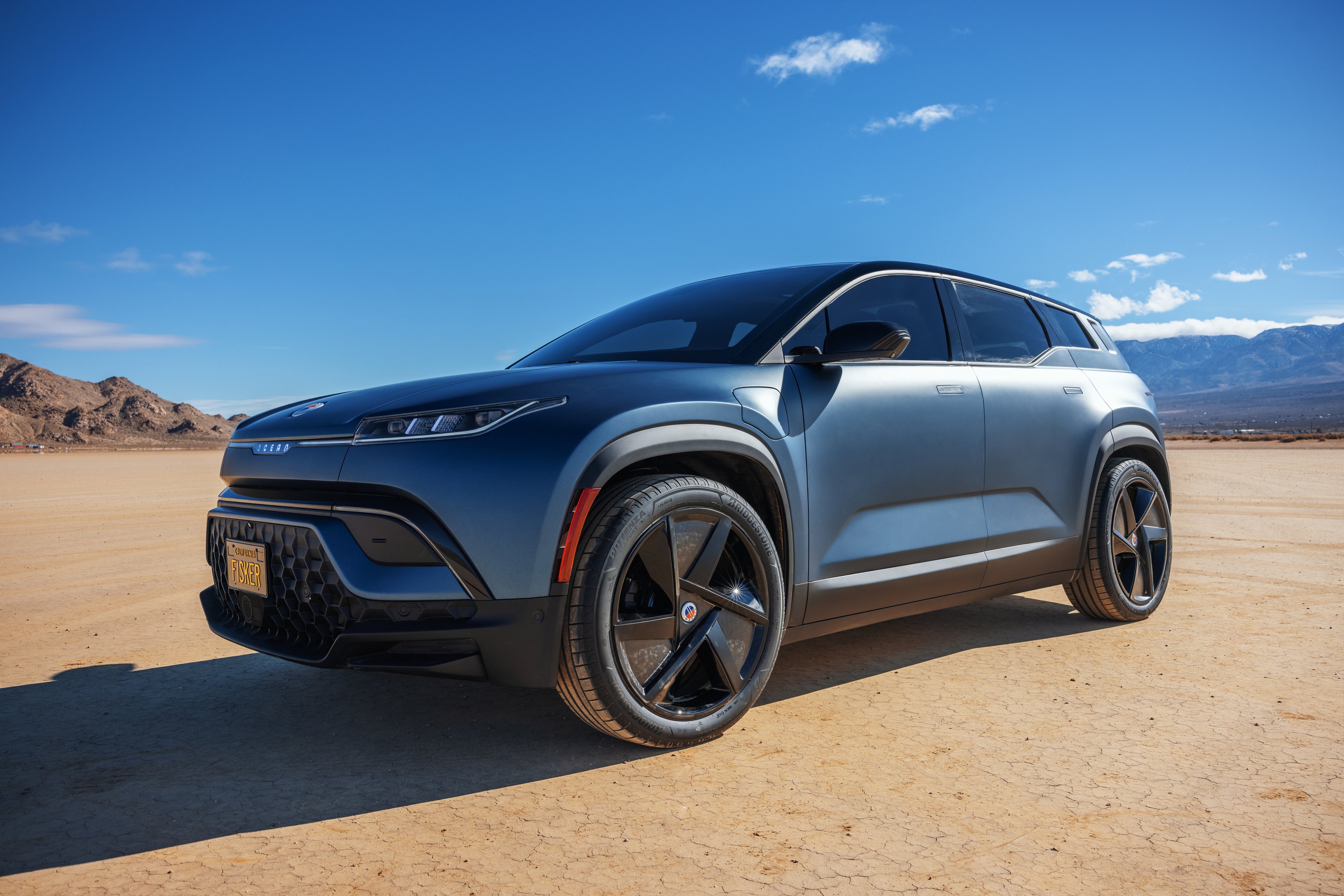A Fisker Ocean on a beach.