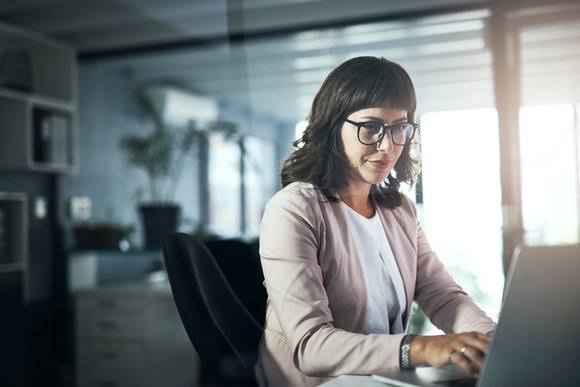 A person at a laptop.