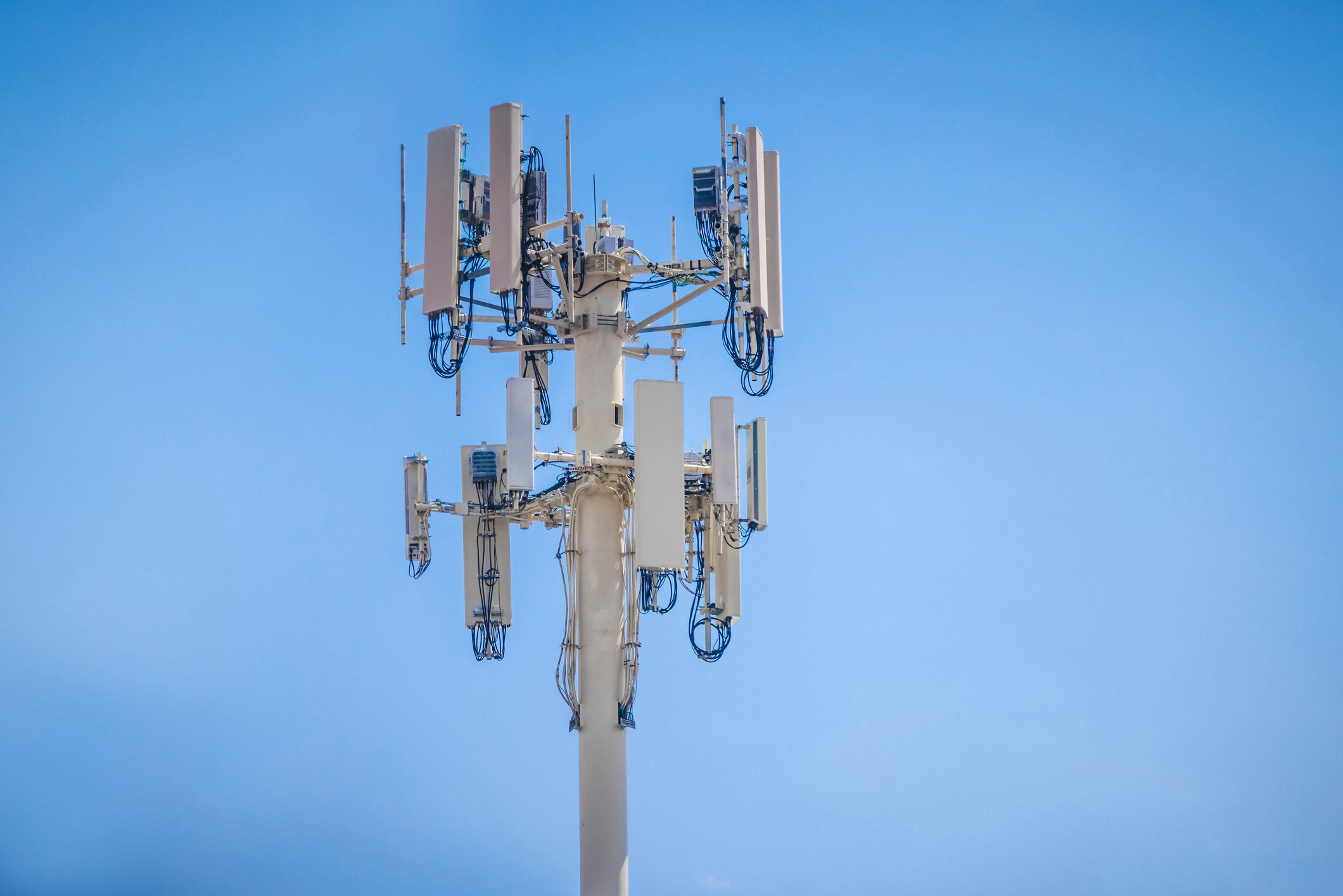 A 5G cell tower during the day.