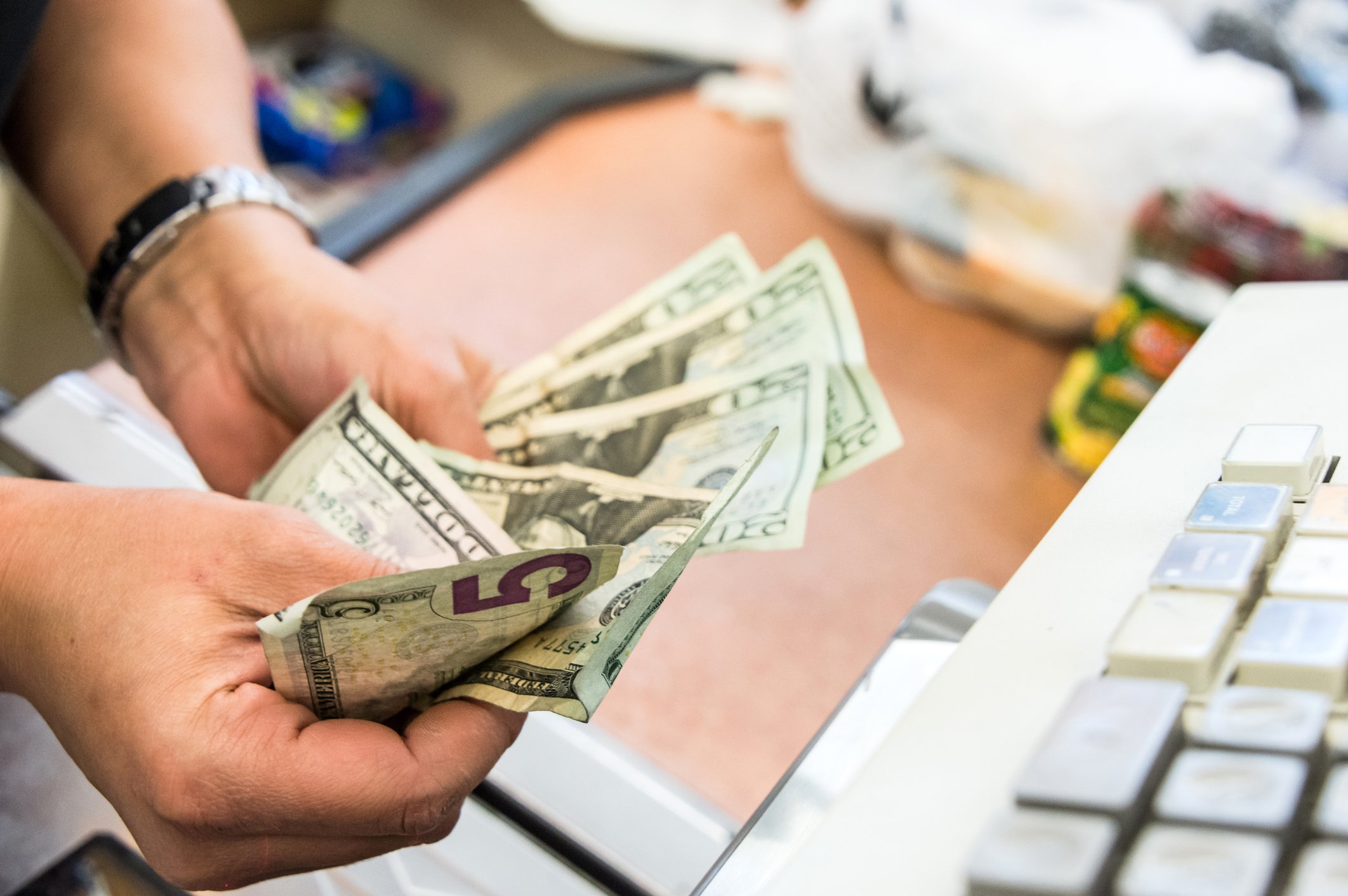 money cash register shopping getty
