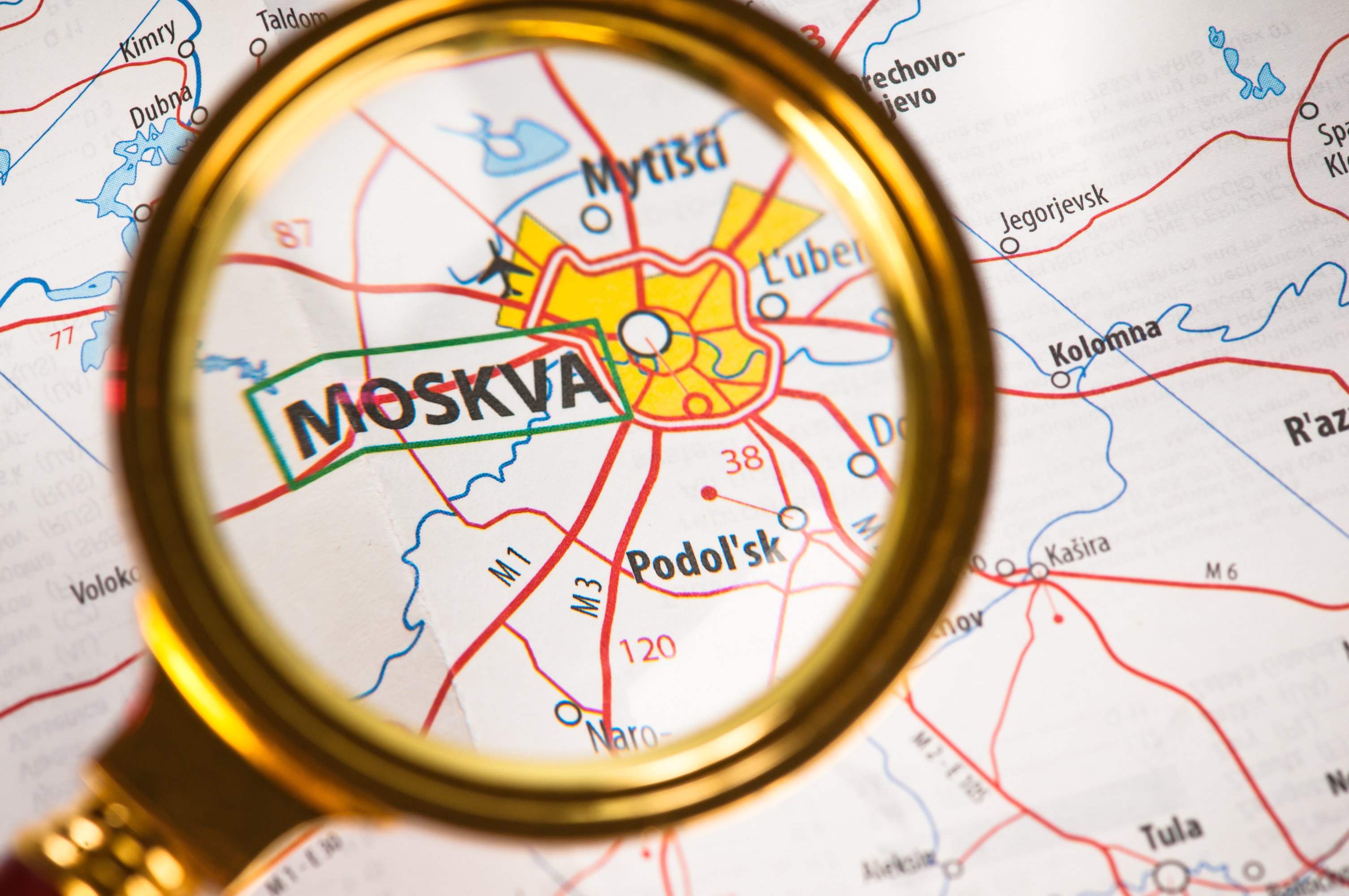 Map of Moscow under a magnifying glass.