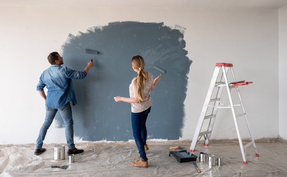People painting a wall.