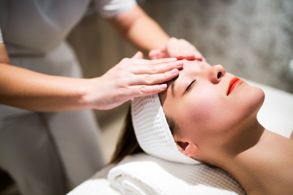 A person is getting a facial skincare treatment. 