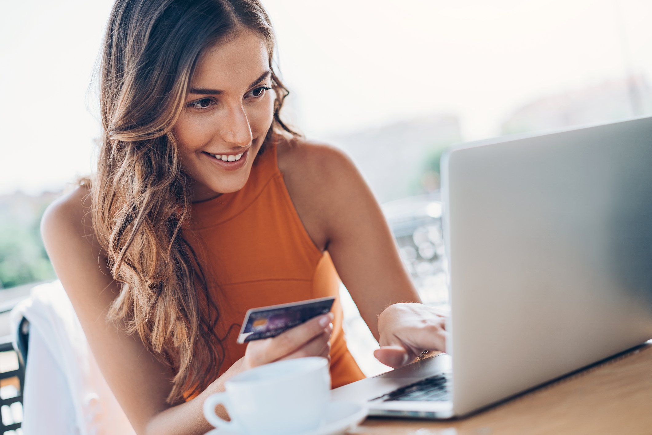 A person shops online with a credit card. 